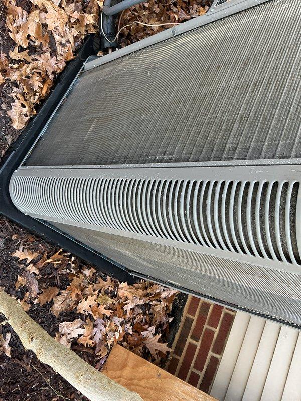 Completed routine Air Care Maintenance on outdoor condensing unit. Inspected condenser coil and noted significant accumulation of dust, debris, and leaf matter on fins and surrounding area. Identified filter requirement HCF20-11 (MERV 11) and documented equipment condition with photos showing dirt buildup on heat exchanger surfaces and seasonal debris around unit perimeter.