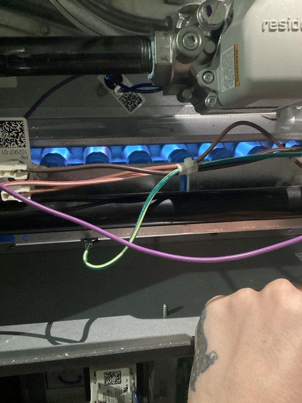Completed annual heating maintenance and tune-up on residential furnace system. Performed comprehensive inspection of all mechanical and electrical components, including blower motor assembly, control board, wiring connections, and gas burner operation. Verified proper ignition sequence and observed clean blue flame pattern across burner assembly, indicating optimal combustion. Inspected Resideo gas valve and associated connections for proper operation and safety. Examined all electrical wiring harnesses, terminal blocks, and control circuitry for secure connections and signs of wear. Confirmed all safety controls and limit switches functioning correctly. System tested and operating within manufacturer specifications with no issues found.