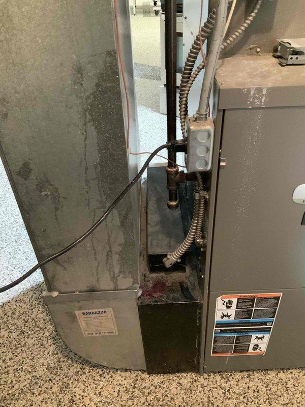 Responded to emergency service call for carbon monoxide leak from existing 15-year-old Lennox furnace system. Conducted comprehensive assessment of current HVAC installation including furnace, ductwork, condensate drainage system, and associated mechanical components. Documented existing system configuration with detailed photography showing furnace unit, flexible metallic ductwork connections, copper refrigerant lines, PVC condensate drain piping, and electrical connections. Provided full system replacement estimate due to safety concerns and age of equipment requiring immediate replacement.
