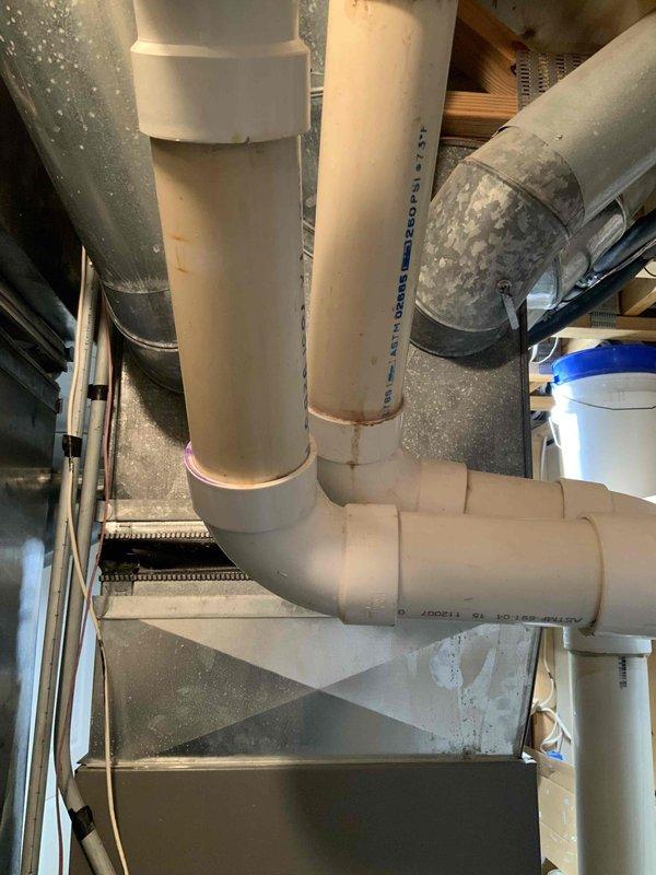 Responded to emergency service call for carbon monoxide leak from existing 15-year-old Lennox furnace system. Conducted comprehensive assessment of current HVAC installation including furnace, ductwork, condensate drainage system, and associated mechanical components. Documented existing system configuration with detailed photography showing furnace unit, flexible metallic ductwork connections, copper refrigerant lines, PVC condensate drain piping, and electrical connections. Provided full system replacement estimate due to safety concerns and age of equipment requiring immediate replacement.