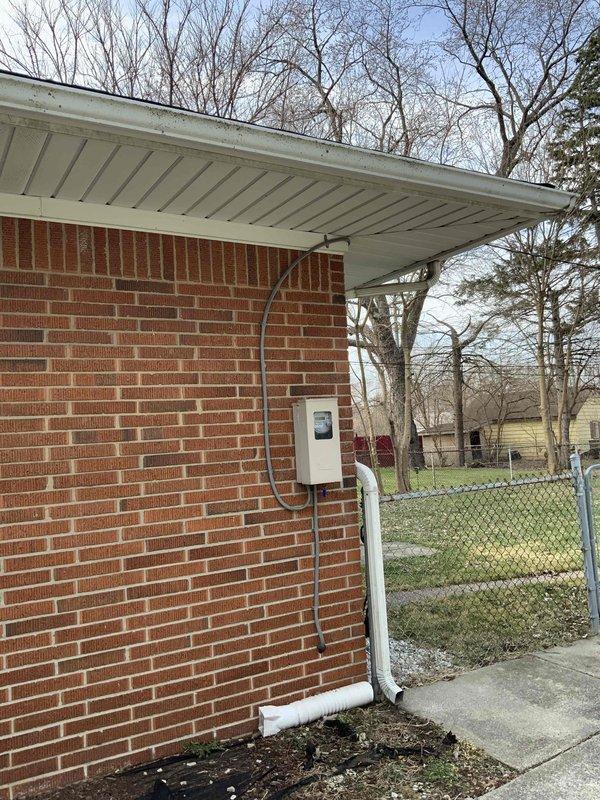 Conducted comprehensive evaluation of 16-year-old residential air conditioning system experiencing refrigerant loss due to substantial leak, suspected to be located in evaporator coil. System utilizes R-22 refrigerant, which is obsolete and no longer manufactured. Documented existing outdoor condensing unit installation on exterior brick wall with proper electrical service and drainage. Assessed indoor furnace and air handler configuration in basement mechanical room, noting current ductwork, condensate drainage system, and overall HVAC infrastructure. Provided detailed estimate for complete air conditioning system replacement, excluding existing furnace, to address non-functional cooling system and upgrade to modern, environmentally-compliant refrigerant technology. Photographed current equipment placement and utility connections for replacement planning purposes.
