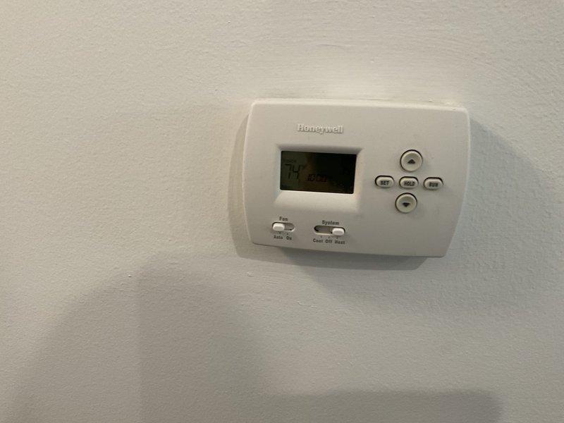Provided estimate for complete HVAC system replacement including furnace and air conditioning unit. Assessed existing 2007 Carrier equipment currently located in utility room, which is still operational but nearing end of service life. Documented current system configuration including thermostat, ductwork, condensate drainage, and electrical connections to prepare comprehensive replacement proposal.