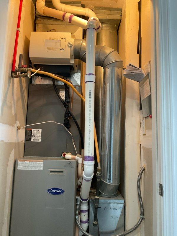 Provided estimate for complete HVAC system replacement including furnace and air conditioning unit. Assessed existing 2007 Carrier equipment currently located in utility room, which is still operational but nearing end of service life. Documented current system configuration including thermostat, ductwork, condensate drainage, and electrical connections to prepare comprehensive replacement proposal.