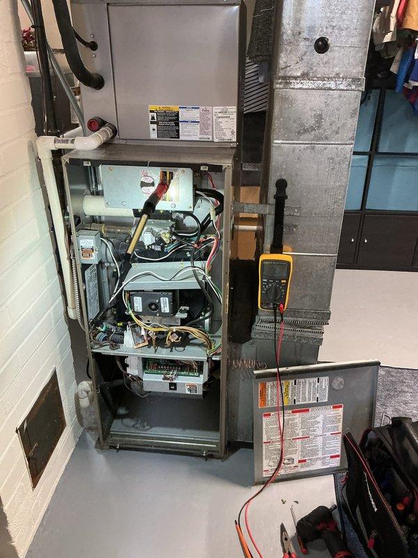 Responded to no-heat call on 16-year-old forced air furnace that was attempting to initiate but failing to run. Upon arrival, performed diagnostic testing with multimeter to check electrical components and control board functionality. Accessed internal compartments to inspect blower motor, gas burner assembly, wiring connections, and safety controls. Measured supply air temperature at ductwork register, which confirmed no heat output at 57.1°F. Identified ignition system failure preventing burner from lighting during call for heat. Completed necessary repairs to restore heating operation and verified proper system cycling and temperature rise across heat exchanger.