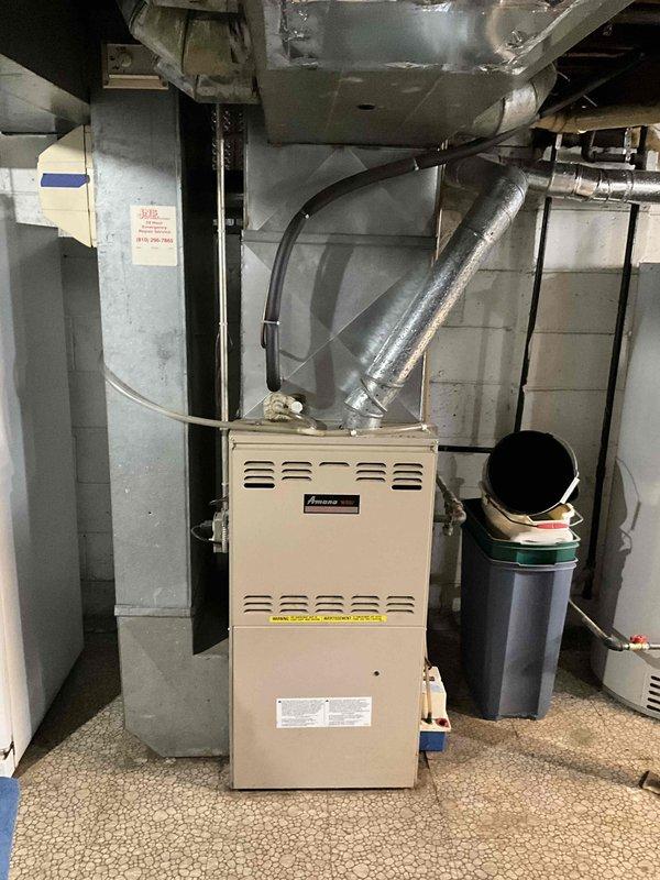 Completed estimate for replacement of 30-year-old furnace and air conditioning system located in basement. Existing equipment currently operational but at end of service life. Evaluated electrical panel capacity, existing ductwork configuration, and equipment placement for replacement system specifications.