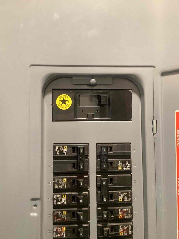 Completed electrical estimate for new whole home Generac generator installation at residential property. Assessed existing electrical panel containing dual columns of circuit breakers and evaluated exterior utility connections including electric meter, gas piping, and conduit routing along brick exterior wall. Determined specifications and requirements for generator integration with current electrical system to provide comprehensive backup power solution for the home.