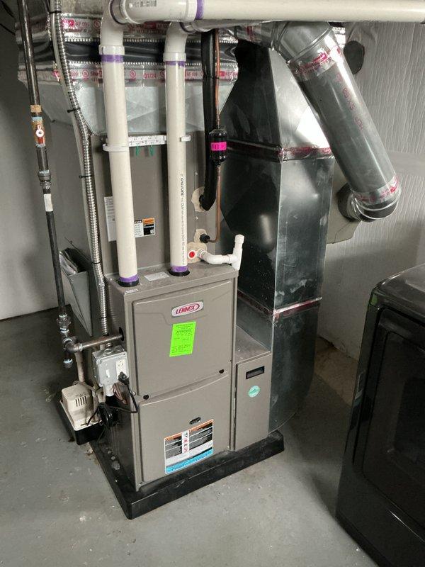 Completed annual maintenance on Lennox furnace system. Performed comprehensive tune-up including inspection of all major components, heat exchanger, burner assembly, and ignition system. Verified proper operation of blower motor, checked and cleaned flame sensor, and tested safety controls. Inspected PVC venting system and condensate drain lines for proper drainage and secure connections. Examined ductwork and plenum connections for air leaks. Confirmed gas pressure and combustion efficiency within manufacturer specifications. Tested thermostat operation and system cycling. All components functioning properly with no deficiencies noted. System operating safely and efficiently. Documented service with photos for maintenance records.