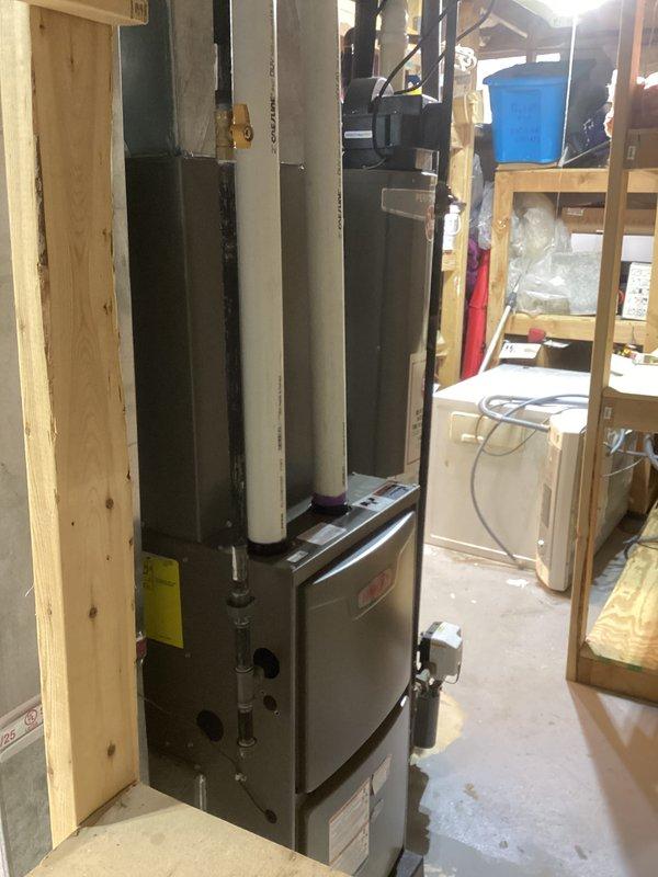 Completed full HVAC system installation including a Lennox 70,000 BTU gas furnace (model CK40CT-30B-71) and 2-ton air conditioning unit with rear discharge configuration. Obtained mechanical and electrical permits prior to installation, positioned furnace in basement utility area between wall studs, connected ductwork and condensate drain lines, and reconnected all existing utilities to new equipment. All paperwork finalized and system operational upon completion.