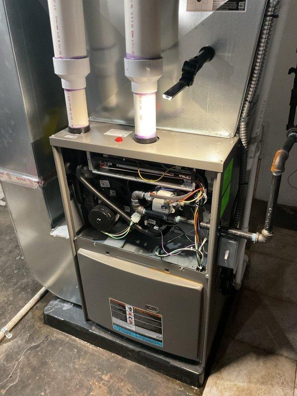 Completed annual furnace maintenance and tune-up on a brand new high-efficiency gas furnace system. Performed comprehensive inspection of all internal components including burner assembly, gas valve, pressure regulator, blower motor, inducer fan, heat exchanger, and electrical connections. Verified proper operation of all safety controls, checked gas pressure and combustion efficiency, inspected PVC intake and exhaust venting system for proper installation and clearances, and confirmed all wiring harnesses and control boards are functioning correctly. Unit operating within manufacturer specifications with no issues found.