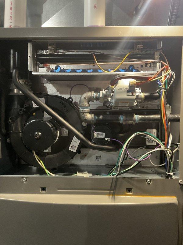 Completed annual furnace maintenance and tune-up on a brand new high-efficiency gas furnace system. Performed comprehensive inspection of all internal components including burner assembly, gas valve, pressure regulator, blower motor, inducer fan, heat exchanger, and electrical connections. Verified proper operation of all safety controls, checked gas pressure and combustion efficiency, inspected PVC intake and exhaust venting system for proper installation and clearances, and confirmed all wiring harnesses and control boards are functioning correctly. Unit operating within manufacturer specifications with no issues found.