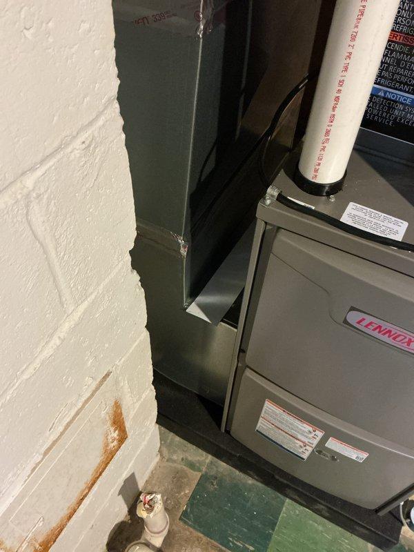 Completed full HVAC system installation including a 70,000 BTU furnace and 2-ton air conditioning unit with rear discharge configuration. Obtained mechanical and electrical permits prior to installation, installed Lennox air handler with proper PVC condensate drainage and venting, connected all ductwork with appropriate metal strapping and hangers, and reconnected existing electrical service. All equipment properly mounted, secured, and tested for operation in basement mechanical room.