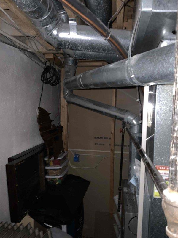 Conducted comprehensive full system HVAC evaluation for 16-year-old furnace and air conditioning system requiring immediate replacement. Assessed existing basement-installed equipment, ductwork configuration, and exterior utility connections to develop complete replacement specifications. Documented current system layout including furnace location, duct runs, refrigerant lines, and electrical service for accurate new system design and installation planning.