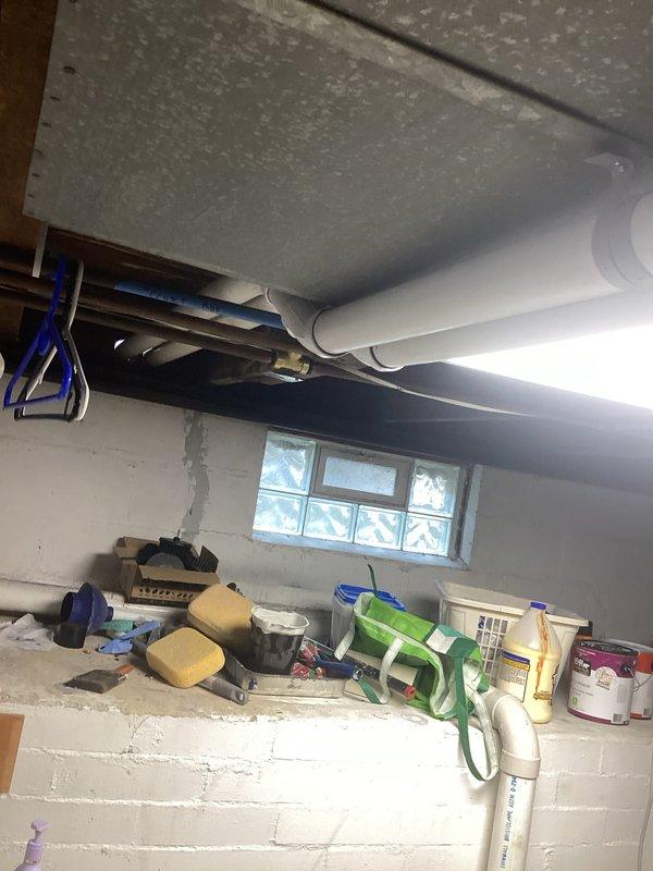 Completed full HVAC system installation including a Lennox 70,000 BTU furnace and 2-ton air conditioning unit positioned on the right side of the property. Installed all necessary ductwork, venting with white PVC piping, electrical connections with blue conduit, and refrigerant lines. All mechanical and electrical permits obtained, equipment properly mounted and secured in basement location, system tested and operational upon completion.