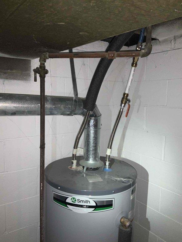 Conducted on-site evaluation for central air conditioning system installation in residential property. Assessed existing HVAC infrastructure in basement mechanical room, including aged air handler unit with oxidation present and associated ductwork connections. Documented current equipment configuration, including flexible ductwork routing, control components, and AO Smith water heater installation to determine optimal placement and compatibility for new central AC system. Provided comprehensive replacement estimate for complete air conditioning unit installation to meet customer's requested timeline of within one month.
