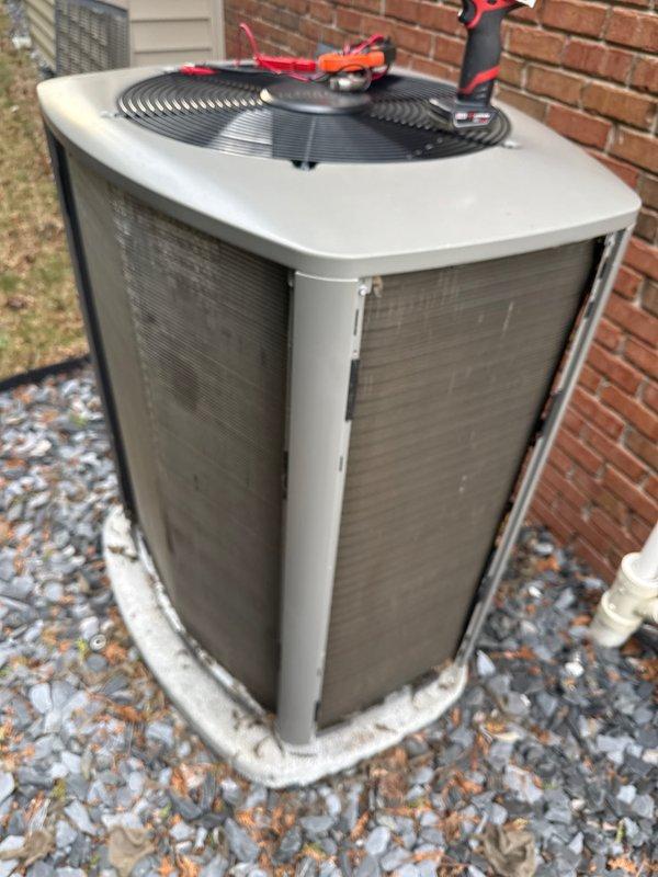 Completed annual preventive maintenance on residential split system air conditioning unit. Performed comprehensive inspection of outdoor condenser unit including visual assessment of cabinet condition, refrigerant lines, electrical connections, and condensate drainage system. Verified proper gravel pad support and clearances around equipment. Unit found in functional condition with age-appropriate wear. All components operating within normal parameters.