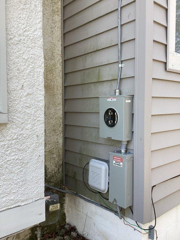 Completed 100-amp electrical panel upgrade with exterior relocation. Coordinated utility disconnect and reconnect services with the power company. Installed new meter socket and outdoor-rated disconnect panel with appropriate conduit and weatherproof enclosures mounted to exterior wall, ensuring code compliance and proper grounding. All work passed final inspection.