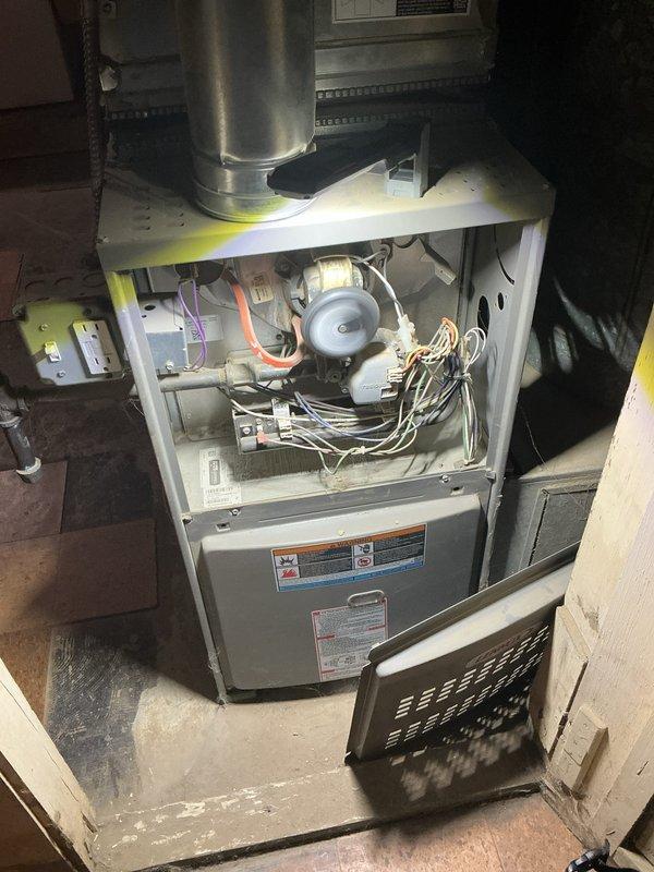 Completed annual heating maintenance on residential furnace system. Performed comprehensive inspection of all internal components including blower motor assembly, electrical connections, and wire harnesses. Removed access panel to access and evaluate blower compartment, verifying proper operation of blower motor and fan assembly. Inspected exhaust vent and flue pipe connections for proper installation and clearances. Checked all visible wiring for signs of wear, damage, or loose connections. Customer requested quote for air purification system installation for future consideration.