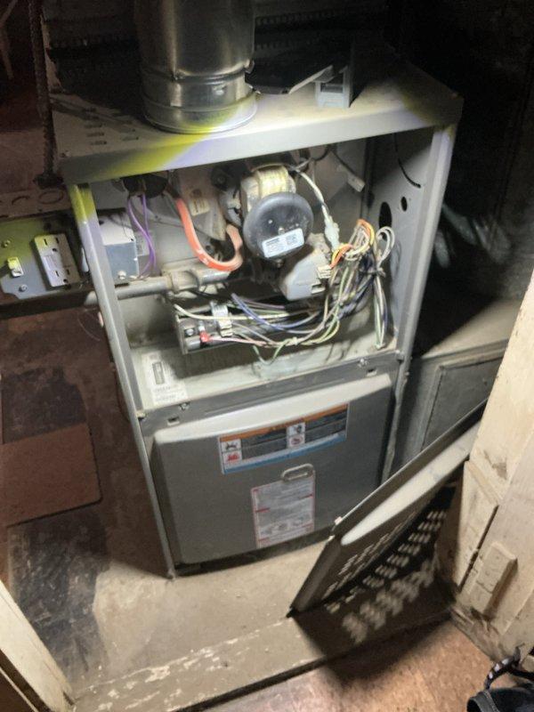 Completed annual heating maintenance on residential furnace system. Performed comprehensive inspection of all internal components including blower motor assembly, electrical connections, and wire harnesses. Removed access panel to access and evaluate blower compartment, verifying proper operation of blower motor and fan assembly. Inspected exhaust vent and flue pipe connections for proper installation and clearances. Checked all visible wiring for signs of wear, damage, or loose connections. Customer requested quote for air purification system installation for future consideration.