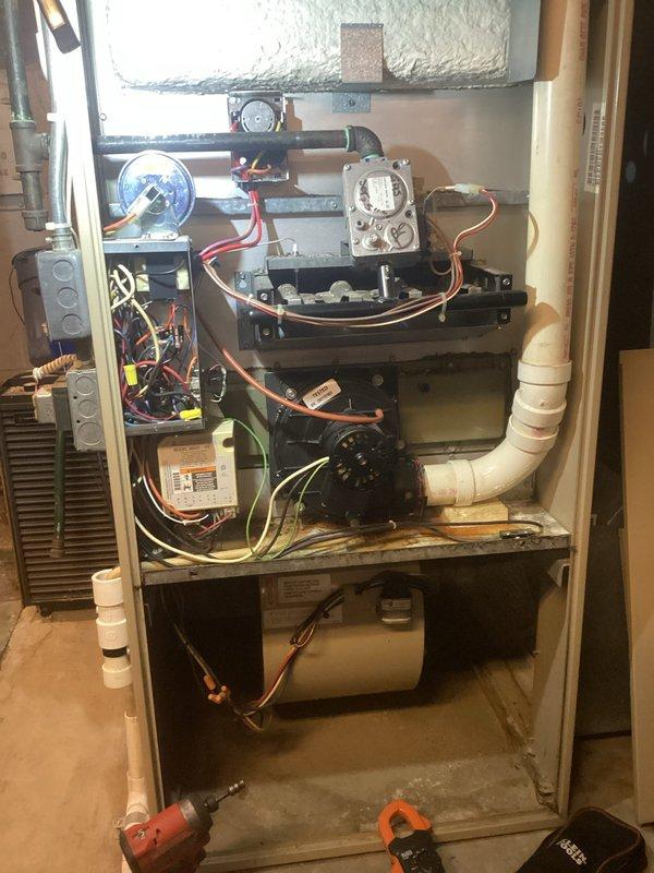 Responded to service call for non-operational furnace in basement. Upon inspection, found 20+ year old furnace system with failed internal components preventing ignition sequence. Diagnosed faulty control board and compromised heat exchanger assembly based on visual inspection and system testing. Discussed repair versus replacement options with customer given age and condition of equipment. Additionally provided estimate for hot water tank replacement as requested. Unit remains non-operational pending customer decision on recommended replacement due to age of system and extent of required repairs.