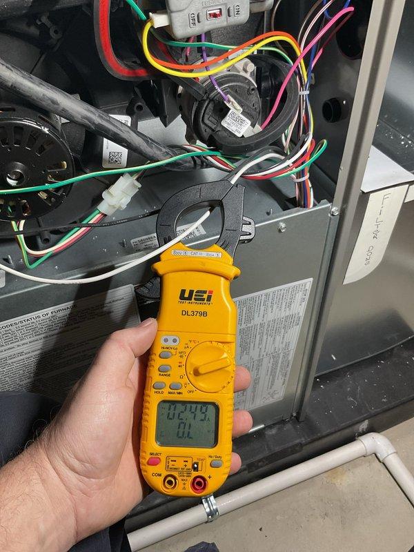 Completed routine HVAC maintenance inspection on air handling unit. Performed electrical diagnostics using digital multimeter to verify proper voltage and amperage readings across system components. Inspected control wiring, blower motor assembly, and electrical connections for proper operation. All measurements within manufacturer specifications. Unit operating normally with no issues identified.