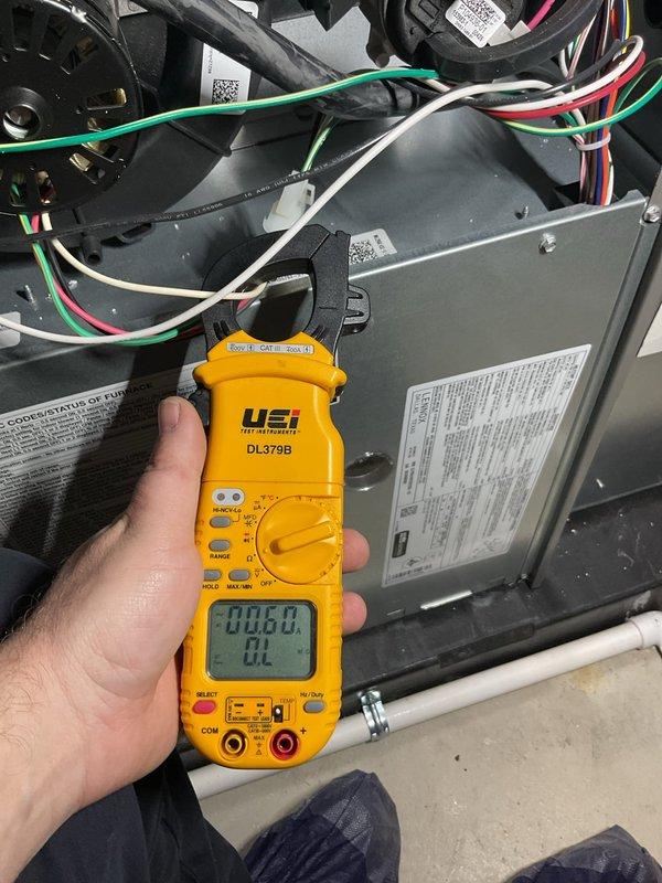 Completed routine HVAC maintenance inspection on air handling unit. Performed electrical diagnostics using digital multimeter to verify proper voltage and amperage readings across system components. Inspected control wiring, blower motor assembly, and electrical connections for proper operation. All measurements within manufacturer specifications. Unit operating normally with no issues identified.