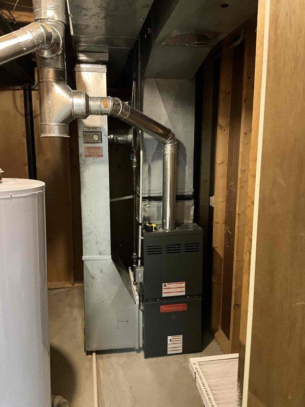 Conducted comprehensive full system estimate for residential HVAC replacement. Evaluated existing 16-year-old air conditioning condenser unit located on exterior concrete pad and 15-year-old furnace in basement mechanical room. Documented current equipment condition, including weathered outdoor condenser with vertical fin configuration and indoor gas furnace with associated ductwork and electrical connections. Assessed existing electrical infrastructure including disconnect boxes and meter configuration. Photographed both indoor and outdoor components to provide detailed equipment specifications for replacement system proposal. Customer requested replacement within the next couple of weeks due to age of existing equipment approaching end of serviceable life.