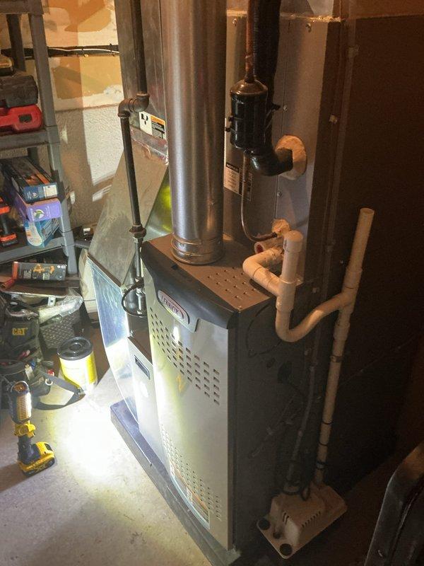 Completed comprehensive ComfortGuard maintenance package on a 3-year-old residential HVAC system including full furnace inspection and AC tune-up. Inspected furnace operation, verified exhaust venting integrity, checked PVC condensate drainage system, and confirmed all safety controls functioning properly. Performed complete air conditioning tune-up on outdoor condenser unit including cleaning coils, testing fan motor operation, verifying refrigerant levels, and inspecting electrical connections. All equipment operating within manufacturer specifications with no issues identified.