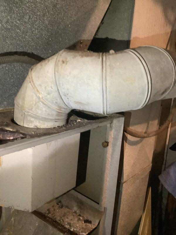 Responded to no-heat call on residential furnace system. Upon arrival, unit was completely non-operational with no error codes displayed on control board. Conducted thorough diagnostic inspection of furnace cabinet and discovered severely deteriorated and displaced insulation material within the unit, along with extensive rust staining on interior metal panels and components. The displaced insulation was protruding into the cabinet space and showed significant contamination and discoloration. Inspected all electrical connections, wiring harnesses, and control mechanisms for damage or interference from the compromised insulation material. Examined ductwork system including main supply plenum and condensate drain pan, noting accumulation of debris and general aging of system components. Documented existing conditions with photographs showing extent of internal cabinet deterioration, insulation failure, and overall system condition. Advised property owner that furnace cabinet integrity ha