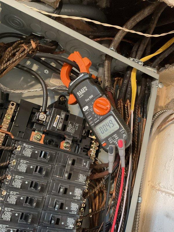 Responded to service call for non-functioning lights in basement laundry room. Performed electrical system diagnostics using digital clamp meter to test circuit loads and identify the fault. Inspected main electrical panel, tested affected circuit breakers, and verified proper amperage readings. Troubleshot wiring connections and resolved the lighting issue, restoring full functionality to all laundry room fixtures.