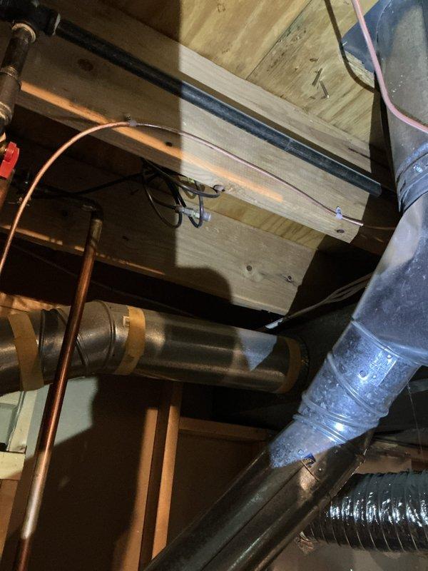 Successfully installed a 17-gallon whole-home humidifier system integrated with the existing HVAC infrastructure. Installation included mounting the humidifier unit between floor joists, routing copper water supply lines with proper bracketing and securing methods, connecting to the ductwork system using metal flex duct with appropriate clamps, and completing all necessary electrical connections. All components were properly secured to structural framing members and tested for proper operation upon completion.