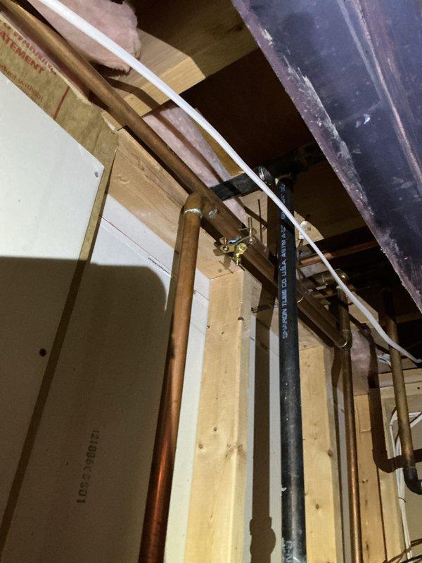 Successfully installed a 17-gallon whole-home humidifier system integrated with the existing HVAC infrastructure. Installation included mounting the humidifier unit between floor joists, routing copper water supply lines with proper bracketing and securing methods, connecting to the ductwork system using metal flex duct with appropriate clamps, and completing all necessary electrical connections. All components were properly secured to structural framing members and tested for proper operation upon completion.