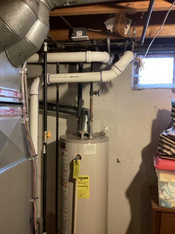 Completed full HVAC system installation including a 70,000 BTU furnace and 2-ton air conditioning unit configured for left-side placement in basement utility area. Reconnected all existing gas lines, ductwork, and electrical connections to new equipment. All mechanical permits obtained and installation performed to code specifications with proper venting and drainage systems in place.