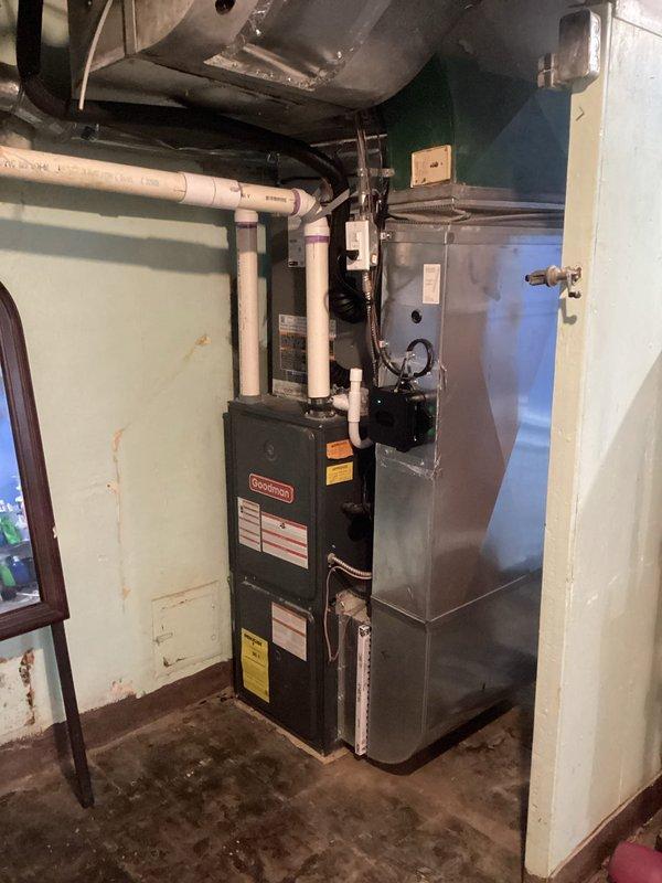 Completed installation of 2.5-ton air conditioning system with evaporator coil in basement mechanical room. Installed new Goodman furnace unit with matching air handler, connected all refrigerant lines, and integrated system with existing ductwork. Verified proper electrical connections at panel, tested all circuit breakers, completed condensate drainage installation with PVC piping, and performed full system startup and operational testing to ensure proper cooling performance.