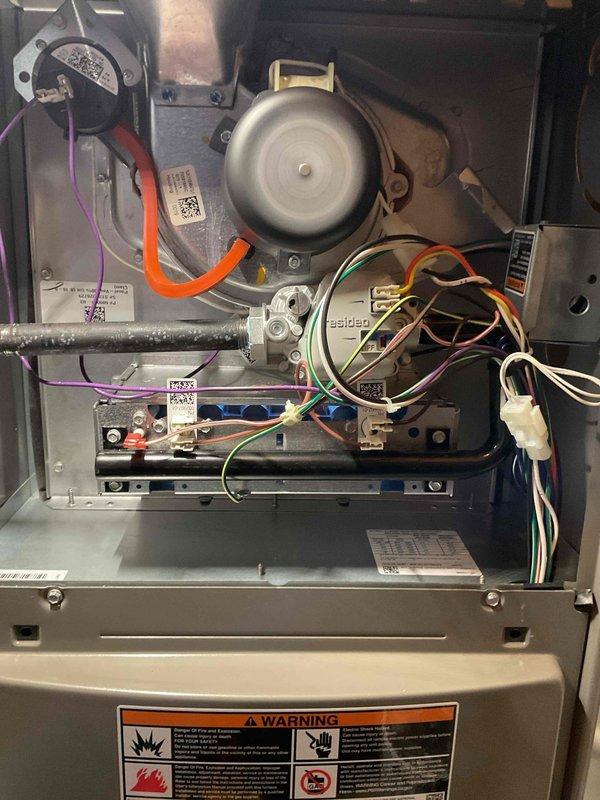 Performed comprehensive annual heating maintenance on residential furnace system. Conducted complete visual inspection of all internal components including draft inducer motor assembly, blower motor housing, and electrical control board. Verified proper operation of pressure switches and safety controls. Inspected all electrical connections and wiring harnesses for signs of wear, damage, or loose connections throughout the unit. Examined control board terminals and junction points to ensure secure connections. Verified integrity of all manufacturer warning labels and component identification markings. Checked mounting brackets and hardware for proper installation and stability. Inspected condensate drainage components and associated tubing for proper routing and connection. Confirmed all safety interlocks and limit switches functioning correctly. System tested and operating within normal parameters with no deficiencies noted. Unit left in proper working condition with all access panels