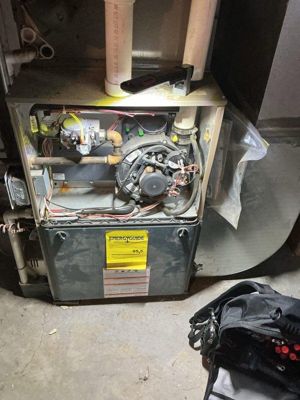 Completed annual furnace maintenance tune-up under air care membership program. Performed comprehensive inspection of high-efficiency 95.5 AFUE furnace system, including removal of front access panels to examine internal components. Inspected blower motor assembly, gas valve operation, electrical connections, and all wiring harnesses for proper function and safety. Verified burner assembly, heat exchanger integrity, condensate drain lines, and PVC venting system. All components operating within manufacturer specifications with no deficiencies noted at time of service.