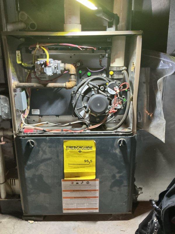 Completed annual furnace maintenance tune-up under air care membership program. Performed comprehensive inspection of high-efficiency 95.5 AFUE furnace system, including removal of front access panels to examine internal components. Inspected blower motor assembly, gas valve operation, electrical connections, and all wiring harnesses for proper function and safety. Verified burner assembly, heat exchanger integrity, condensate drain lines, and PVC venting system. All components operating within manufacturer specifications with no deficiencies noted at time of service.