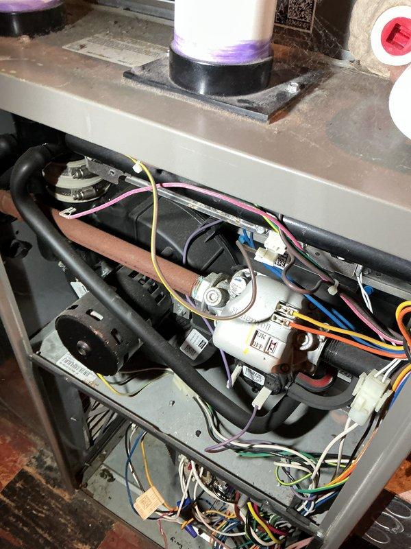 Completed annual furnace maintenance and tune-up as part of Air Care Membership with no issues reported. Performed comprehensive inspection of all internal components including gas valve, blower motor assembly, heat exchanger, and electrical connections. Verified proper operation of Honeywell control valve, checked all wiring terminations, inspected copper tubing connections, confirmed capacitor functionality, and ensured all mechanical components were secure and operating within manufacturer specifications.