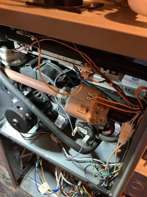 Completed annual furnace maintenance and tune-up as part of Air Care Membership with no issues reported. Performed comprehensive inspection of all internal components including gas valve, blower motor assembly, heat exchanger, and electrical connections. Verified proper operation of Honeywell control valve, checked all wiring terminations, inspected copper tubing connections, confirmed capacitor functionality, and ensured all mechanical components were secure and operating within manufacturer specifications.