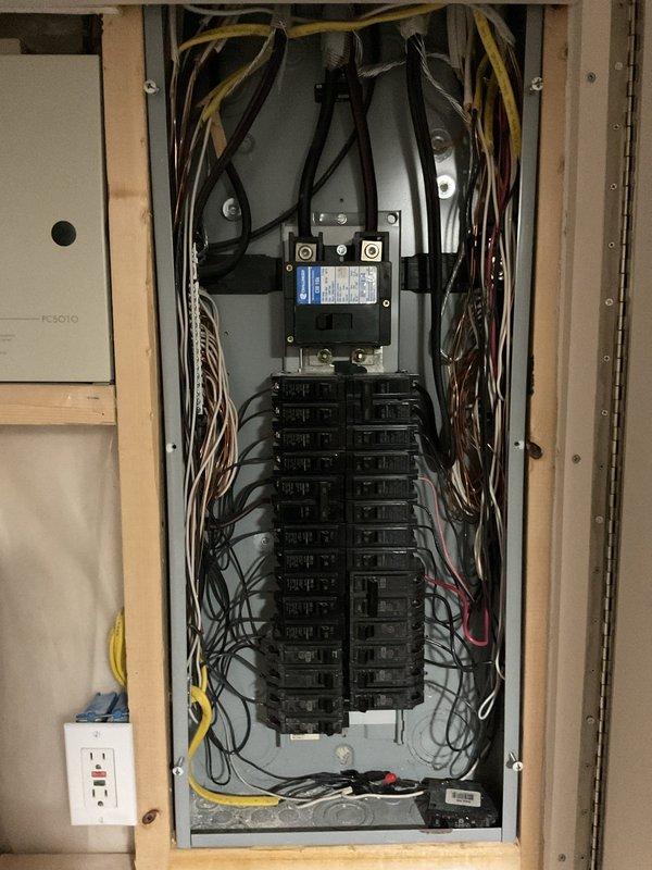 Responded to service call for melted dryer outlet requiring replacement along with additional outlets throughout the home. Performed comprehensive electrical assessment including inspection of main electrical panel, circuit breakers, and distribution system. Documented existing panel configuration showing main breaker and approximately 16-20 individual circuit breakers with organized wiring in multiple colors throughout the installation. Evaluated circuit breaker conditions, amperage ratings, and wire connections to identify any potential safety concerns or code violations related to the damaged outlet. Provided estimate for replacement of damaged dryer outlet and additional outlets as requested by customer.
