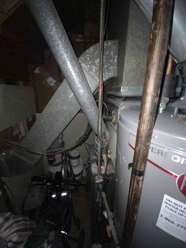 Conducted on-site evaluation of existing residential heating and cooling system for replacement estimate. Inspected attic-mounted air handler unit and assessed ductwork configuration, noting equipment age unknown per customer request. Documented current HVAC equipment location, electrical connections, and existing duct system through photographic records to facilitate replacement planning and expedited installation scheduling upon approval.