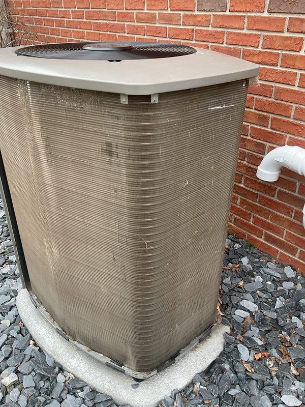 Completed ACM3/312-5 maintenance on residential air conditioning system. Performed refrigerant pressure and temperature diagnostics using digital manifold gauge set, recording low-side pressure of 109.6 PSIG and high-side pressure of 268.7 PSIG with corresponding saturation temperatures. Inspected outdoor condenser unit positioned on concrete pad, verified proper airflow through coil fins, and confirmed fan grille protection in place. Unit operating within normal parameters with no refrigerant leaks detected. All system components functional and equipment ready for continued service.