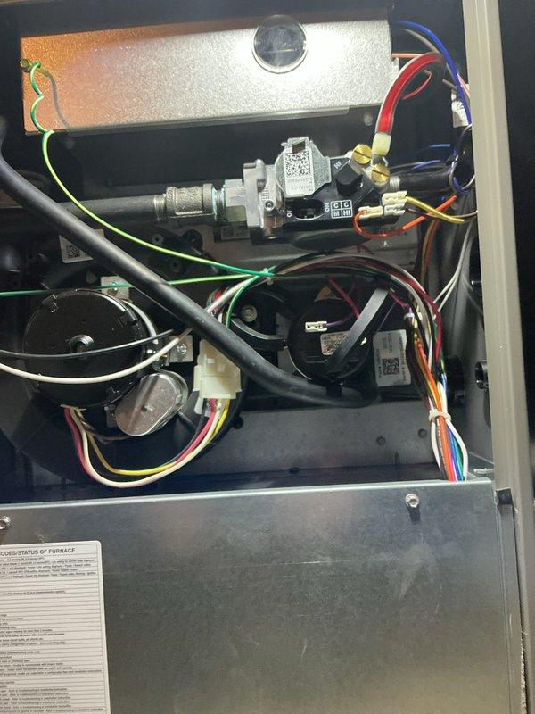Completed annual furnace maintenance and tune-up on residential heating system. Performed comprehensive inspection of gas valve assembly, pressure switch, burner components, and all electrical connections. Verified proper operation of blower motor, confirmed all wire harnesses secure, checked gas line connections for leaks, and tested safety controls. All components found operating within manufacturer specifications with no issues detected. System photographed and left in proper working condition.