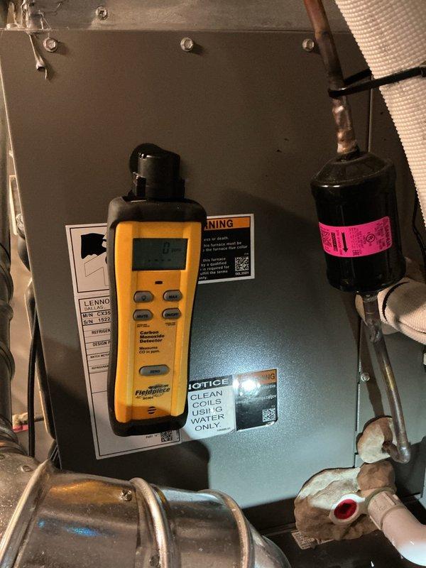 Responded to service call regarding reported furnace rust and potential gas leak on 3-year-old Lennox unit that another contractor identified as improperly installed with CO leakage concerns. Performed comprehensive diagnostic inspection and combustion analysis using digital testing equipment to measure carbon monoxide levels and assess system safety. Conducted thorough visual inspection of heat exchanger, venting system, and gas connections while documenting conditions with detailed photography of equipment, control panels, warning labels, and associated HVAC components for warranty and safety verification purposes.