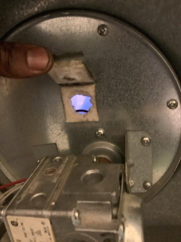 Diagnosed HVAC system with faulty control board and failed blower motor. Verified gas burner operation showing proper blue flame combustion. Ordered replacement control board (Part #903429A) and blower motor from supply house under PO #1305393-001. Return visit scheduled to complete installation of both components and restore system to full operation.