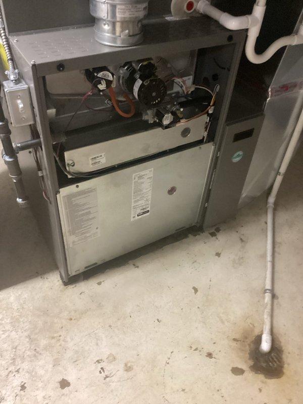 Completed annual furnace maintenance and tune-up on residential heating unit. Performed comprehensive inspection of all internal components including blower motor assembly, gas valves, control mechanisms, and electrical connections. Verified proper operation of burner assembly, checked and cleaned blower compartment, inspected heat exchanger for cracks or deterioration, and tested all safety controls. Examined venting system including PVC intake and exhaust piping for proper installation and secure connections. Confirmed adequate airflow through ductwork and verified thermostat communication with furnace controls. All systems tested and found operating within manufacturer specifications upon completion of maintenance service.