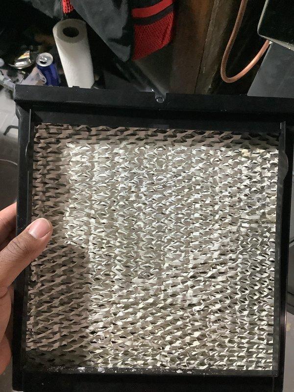 Performed routine air handler maintenance on rooftop air conditioning unit. Inspected and replaced dirty air filters, removing heavily soiled mesh pre-filter and installing new pleated filter media to restore proper airflow and system efficiency.