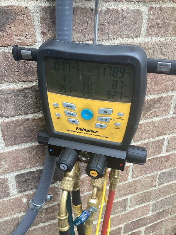Responded to service call for AC not working with reported issue of power not shutting off at circuit breaker. Upon arrival, appointment was converted to preventive maintenance tune-up per customer request. Performed complete AC maintenance on approximately 1-year-old system with basement-located air handler and outdoor condenser unit. Conducted refrigerant pressure and temperature diagnostics using manifold gauges, verified system operating parameters, and inspected outdoor condenser unit. All work completed under active parts and labor warranty coverage.