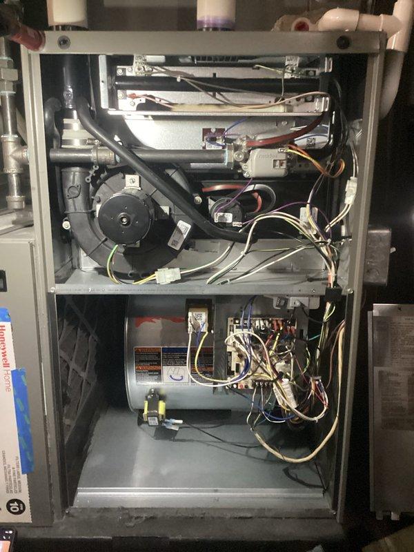 Completed comprehensive ComfortGuard maintenance package on gas furnace and air conditioning system. Performed thorough inspection of internal components including blower motor assembly, heat exchanger, burner assembly, and electrical control systems. Addressed customer concern regarding missing insulation on refrigerant lines inside unit by inspecting copper line set and documenting condition. Verified system pressures and temperatures using refrigerant manifold gauges, confirming proper refrigerant charge and system performance within manufacturer specifications.
