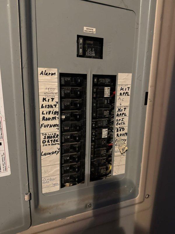 Completed recall to address code violations from recent HVAC installation of 70,000 BTU furnace with humidifier and 2-ton air conditioning unit. Installed weatherproof GFCI receptacle outlet on exterior siding within required 25-foot distance of outdoor condensing unit and added proper circuit identification labels to electrical panel to bring installation into compliance with electrical code requirements.