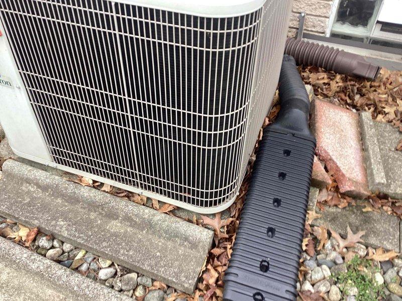 Completed annual maintenance on outdoor air conditioning unit. Contacted customer via landline prior to arrival. Performed comprehensive system inspection, replaced air filter, and cleaned condenser coils. Removed accumulated leaves and debris from around unit base and grille area to ensure proper airflow and system efficiency.